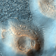 Illustration for article titled Martian mud volcanoes may hold the secret to life on Mars